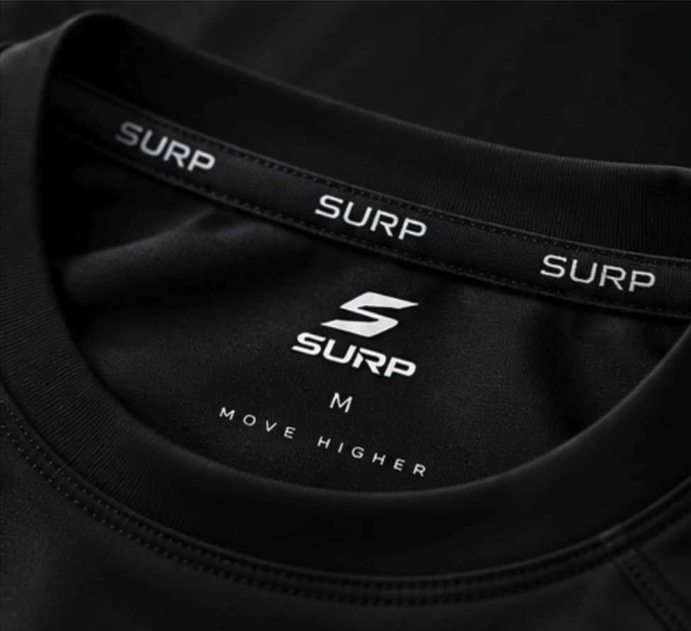 Close-up of a black SURP shirt collar and inner neck branding