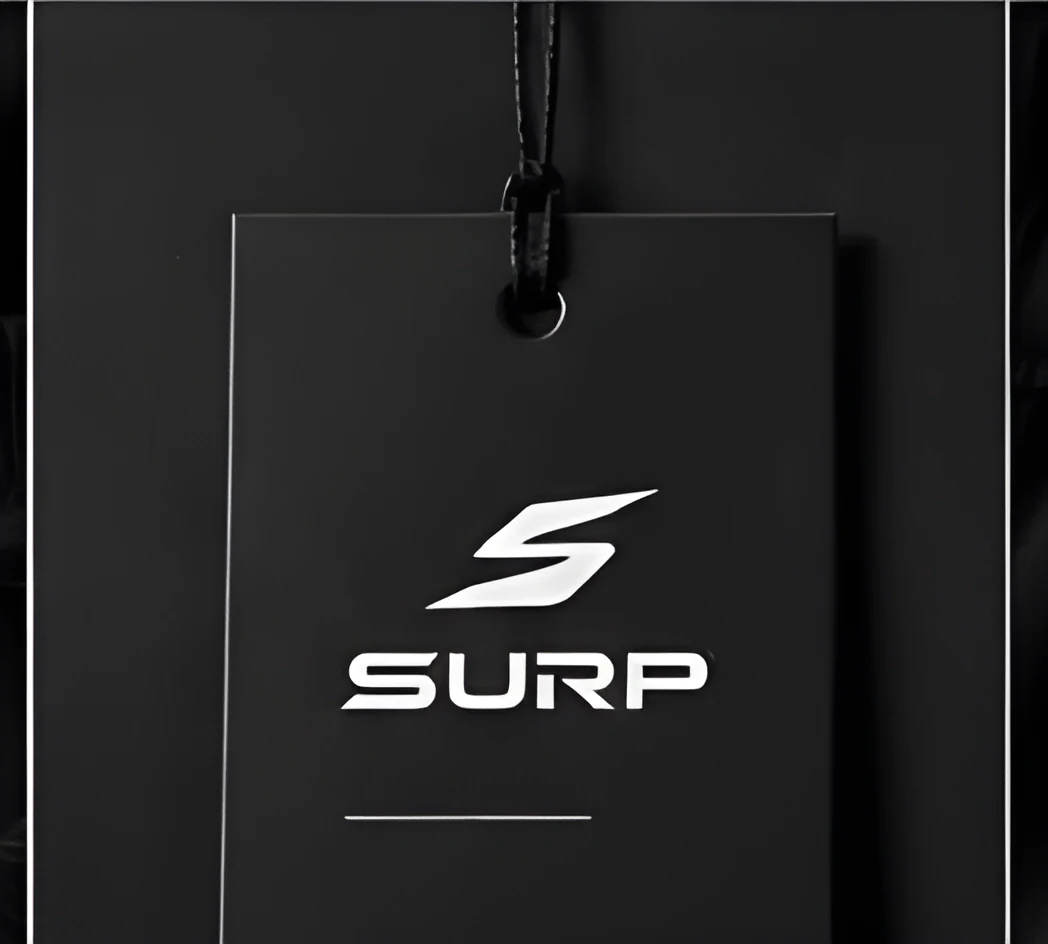 SURP hang tag on black fabric