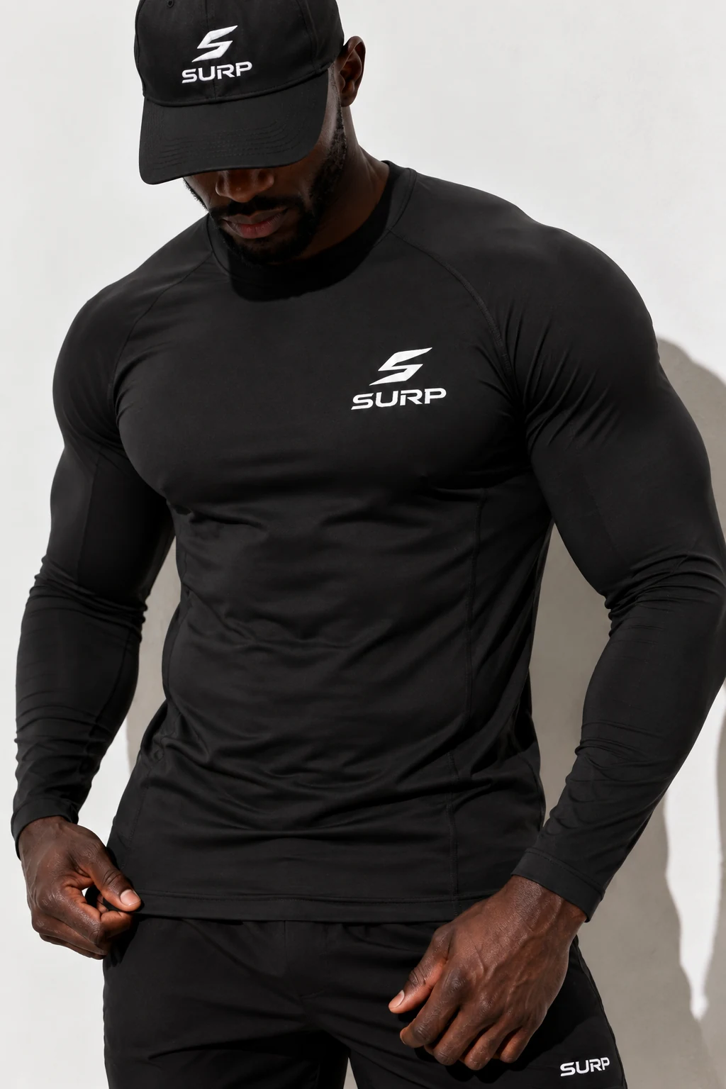 Close-up of a male SURP athlete in a black long sleeve and cap
